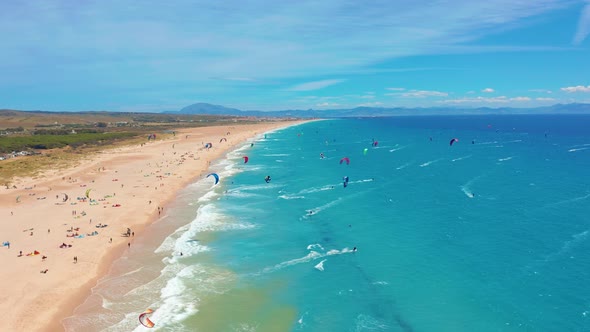 Aerial View of Kitesurfing Extreme Sport with the Wind Freestyle. Beautiful Top View of Nice Beach