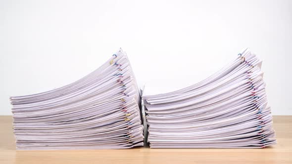 Stop motion animation Stacks overload document paper files on office desk