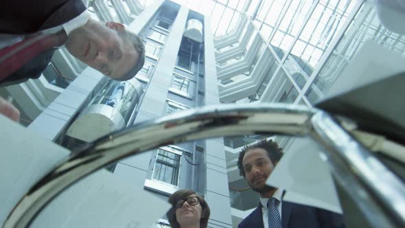 Business People Signing Contract on Glass Table