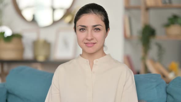 Indian Woman Smiling at Camera at Home