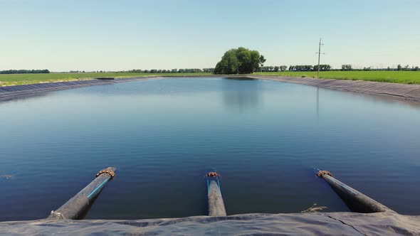 Aero. Irrigation Reservoir with Pipes. Man-made Special, Water Storage Pool, Tank for Agricultural