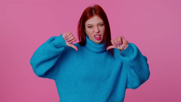 Upset Girl in Blue Sweater Showing Thumbs Down Sign Gesture Disapproval Dissatisfied Dislike