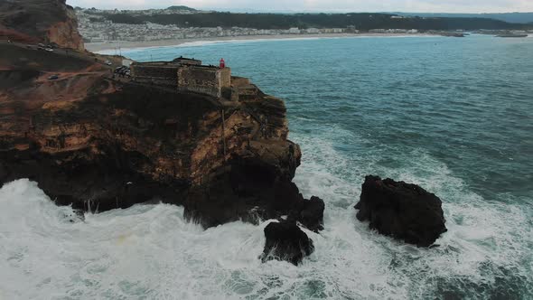 Viewing Point with Lighthouse on Cliff Near Ocean Aerial