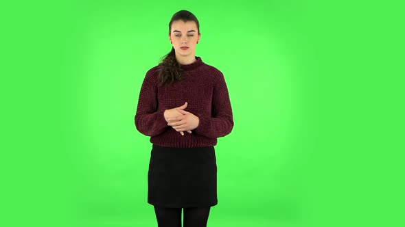 Female Stands Worrying in Expectation Then Smiles with Relief, Carried. Green Screen