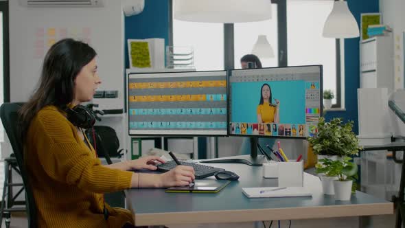 Woman Graphic Editor Retouching Photos of Client in Professional App