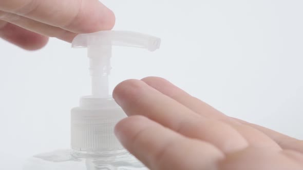 Sanitizer gel on alcohol base  taken by fingers close-up footage