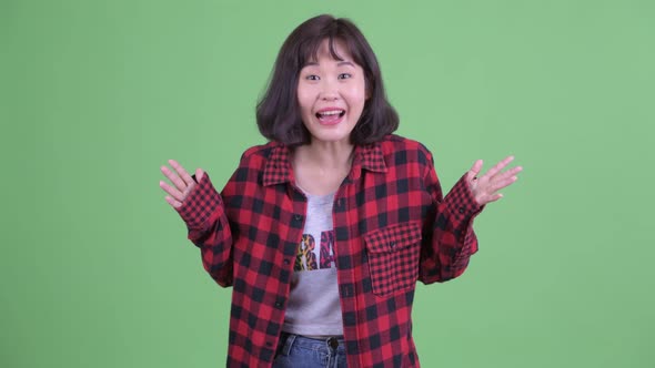 Happy Asian Hipster Woman Talking and Looking Excited