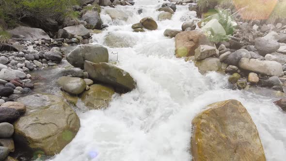 Mountain River with Rapid Water in Slow Motion Aerial View
