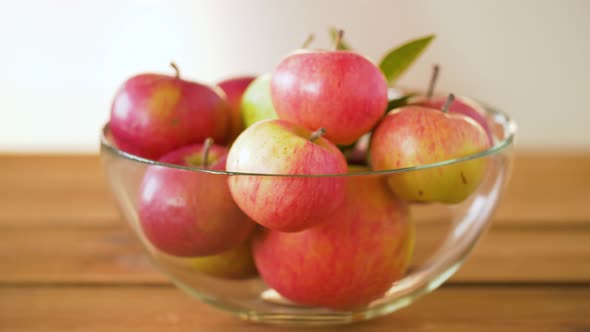 Ripe Apples in Glass Bowl on Wooden Table 