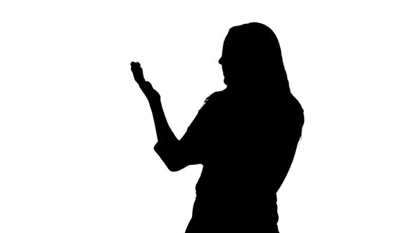 Silhouette Of Young Woman Talking alt