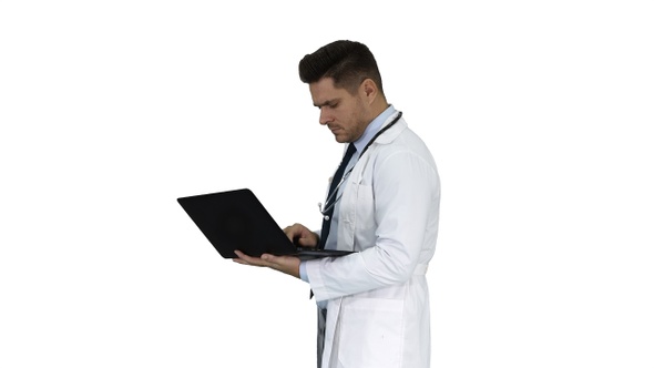 Man wearing white medical coat and stethoscope walking