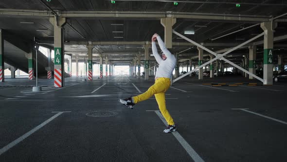 Contemporary Street Dancer Man Funky Urban is Dancing Freestyle in the City