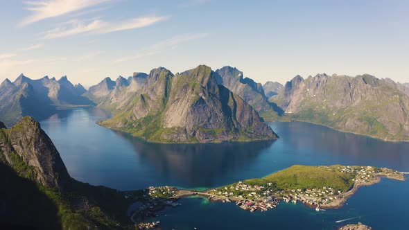 Pan Right of Reine Fishing Village with Mountains and Fjords on Lofoten Islands