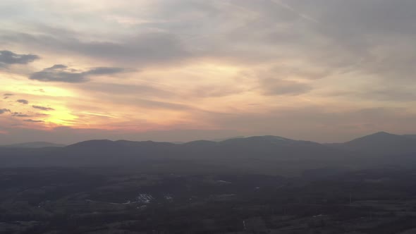 Colorful sky above mountains Stol and Deli Jovan 4K drone video