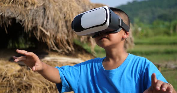 Rural Little Boy Explores In VR alt