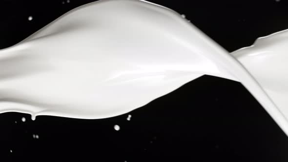 Super Slow Motion Shot of Milk Spiral Splash Isolated on Black Background at 1000 Fps