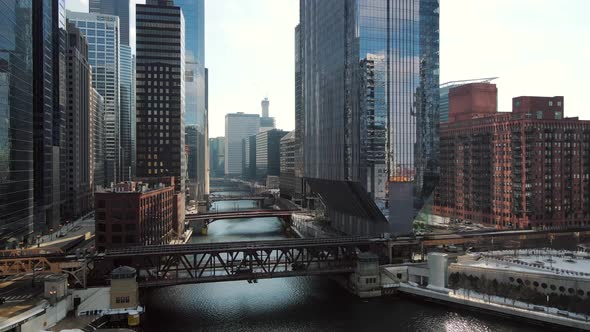 Drone Flies As Train Crosses Bridge Over River in Downtown Chicago Loop