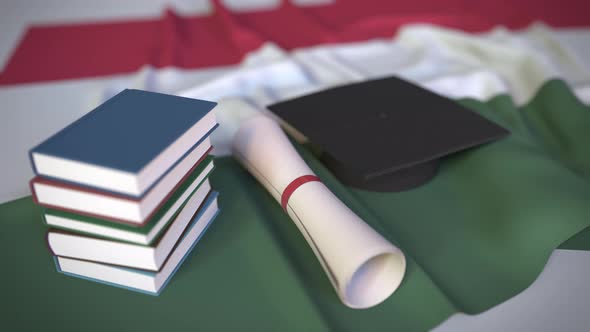 Graduation Cap and Diploma on the Flag of Hungary