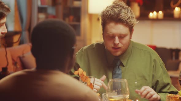 Three Men Having Dinner