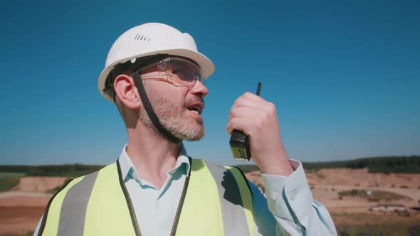 Handheld Portrait Handsome Male Sand Quarry Worker Wearing Safety Uniform