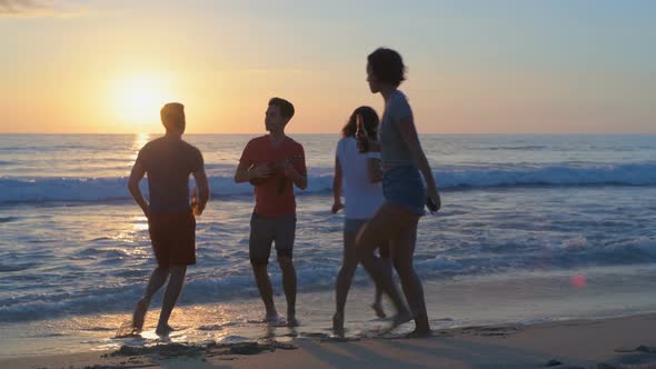 Group of friends dancing on the beach 4k