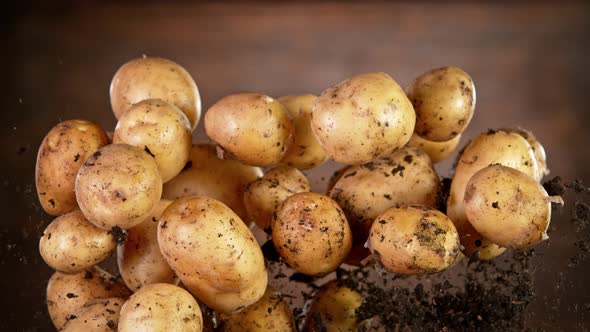 Super Slow Motion Shot of Flying Potatoes with Soil at 1000 Fps