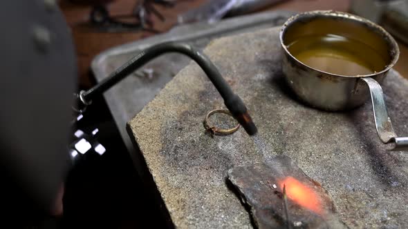 Closeup of Wedding Ring Polishing By Caicasian Jeweler Isolated  Footage