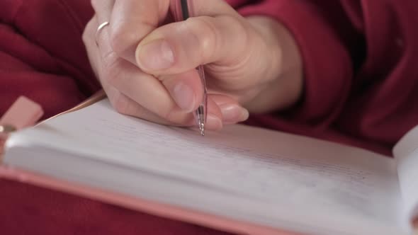 Woman Writing in Diary