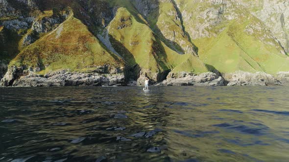 Standup Paddling Towards the Mountainside