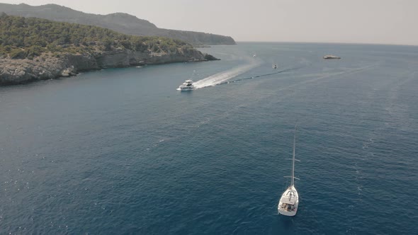 Aerial View of Yachts Near Rocky Island of Mallorca