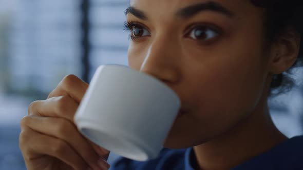 Business Woman Drinking Coffee During Break in Office