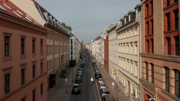 Forwards Tracking Shot of Cyclists Riding Through Linienstrasse Cycle Route Street