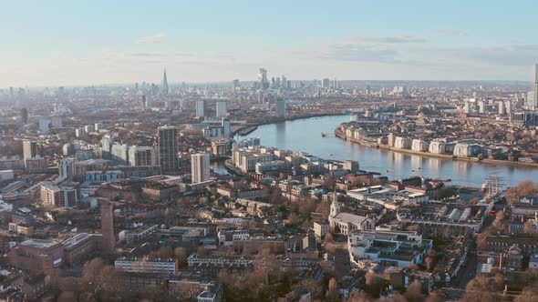 Drone shot towards central London skyline from Greenwich at sunset