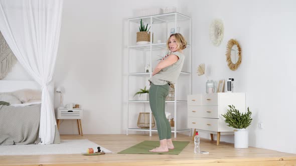 Female Yoga Trainer Demonstrating Asana for Her Followers