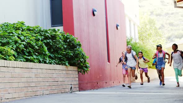 Classmates running at school campus