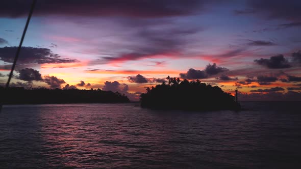 an incredible sunset in the banda sea, seen from a boat with the camera zooing out.