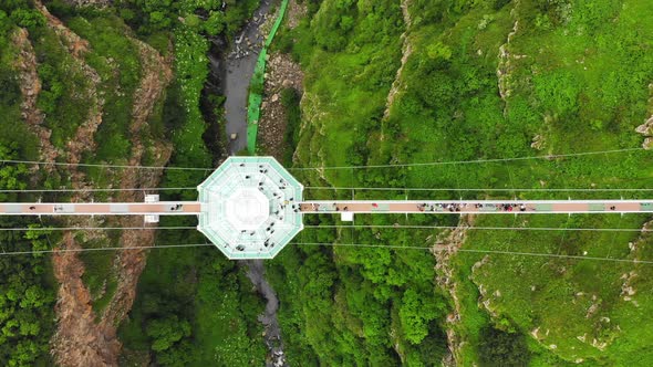 Glass Bridge Over Valley With Tourist