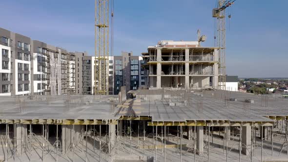 Building crane and monolituc building under construction. Construction site