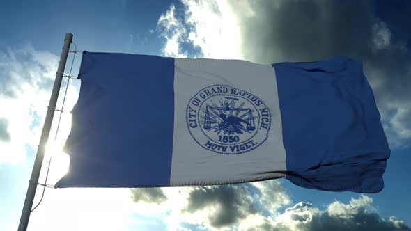 Flag of Grand Rapids City City of Michigan United States of America Waving at Wind in Blue Sky
