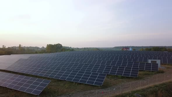 Aerial Drone Flight At Sunset Over Solar Panels Farm Green Energy Ver 11