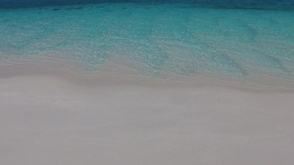 Summer landscape of island beach by blue lagoon with sand background near surf