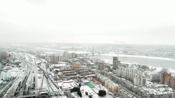 Aerial Survey of a Winter City in the Snowfall