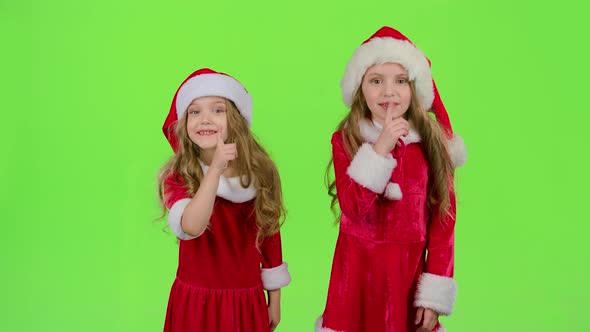 Baby of the Assistant Santa Claus Say Quietly To Their Elves. Green Screen. Slow Motion