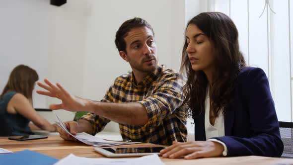 Millennial creative professionals working in a creative office