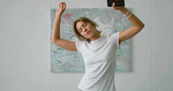 Young Woman in Romantic Mood Is Dancing on Bed, Close Up