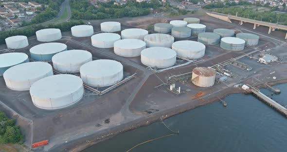 Aerial view equipment of oil refining with a large oil storage tank