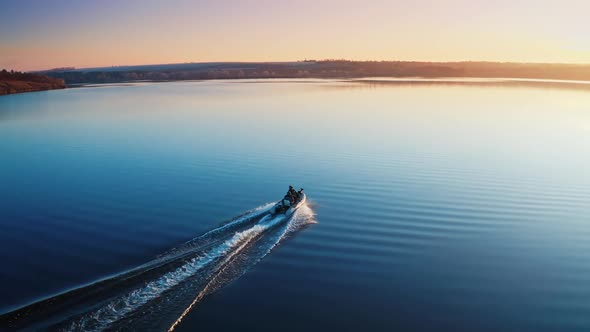 Motor boat on the river. Aerial drone view of rest on the river by boat