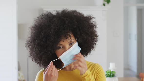 Woman wearing face mask at home