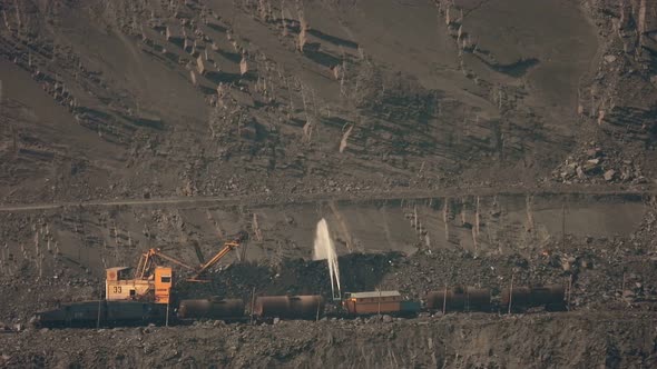 Irrigation with water in an open iron ore quarry.