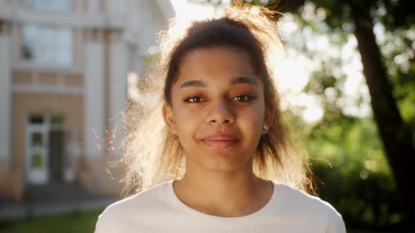 Portrait of Beautiful African American Young Woman Smiling at Camera Looking Confident